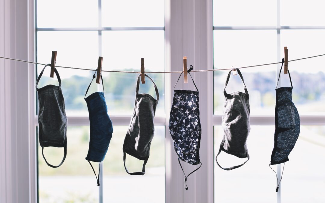 Cotton face masks hanging on a clothesline