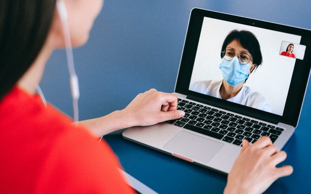 woman video chatting with man on laptop