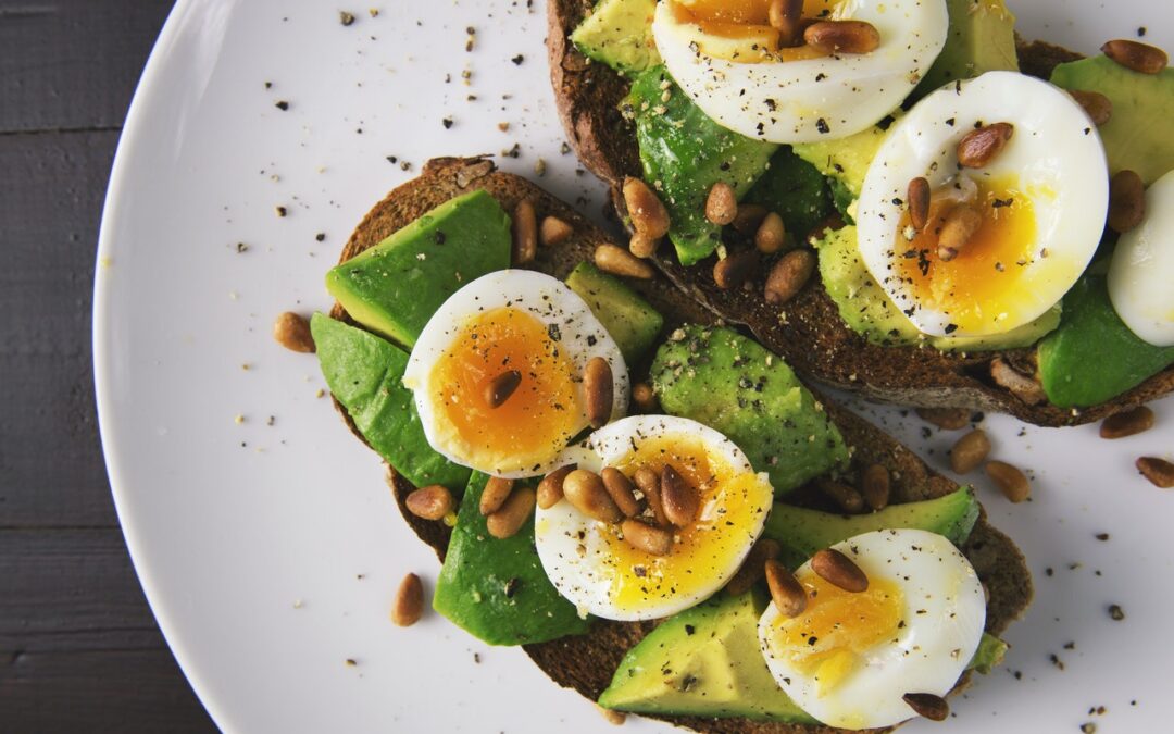 Avocado toast with fried egg on a plate