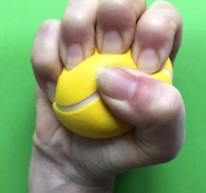 Woman's Hand Squeezing a Stress Ball